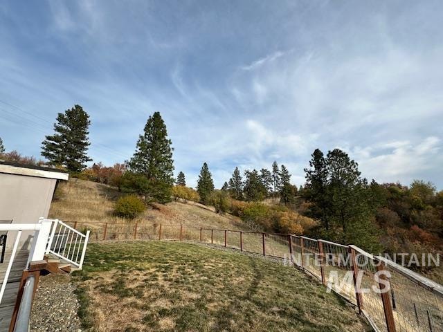 view of yard with a rural view