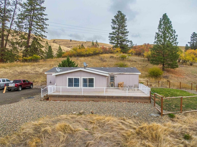 exterior space featuring a deck with mountain view