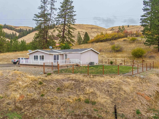 view of yard featuring a rural view and a mountain view