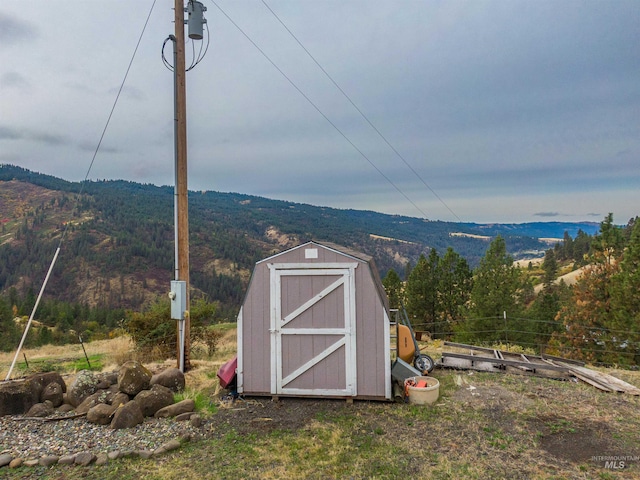 view of outdoor structure featuring a mountain view