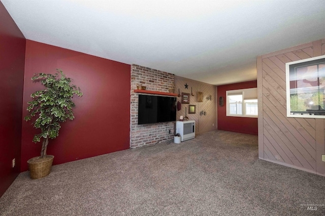unfurnished living room featuring carpet floors