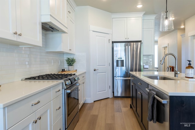 1946 W Windswept, Meridian, ID 83646 - kitchen with appliances with stainless steel finishes, light wood-type flooring, white cabinetry, and recessed lighting