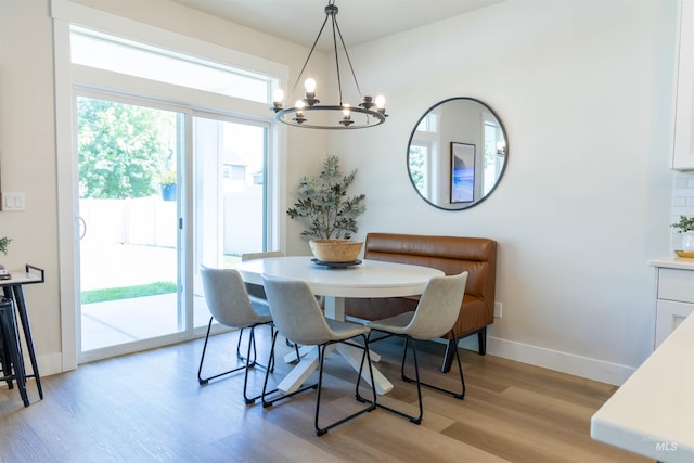 1946 W Windswept, Meridian, ID 83646 - dining room with a chandelier and light wood-type flooring