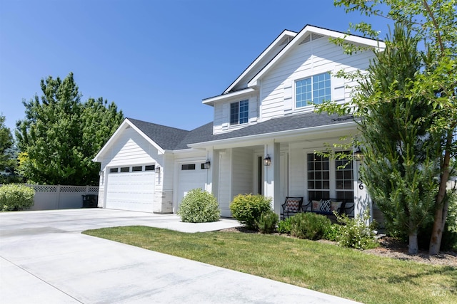 1946 W Windswept, Meridian, ID 83646 - view of front of property featuring a porch, a garage, driveway, and roof with shingles