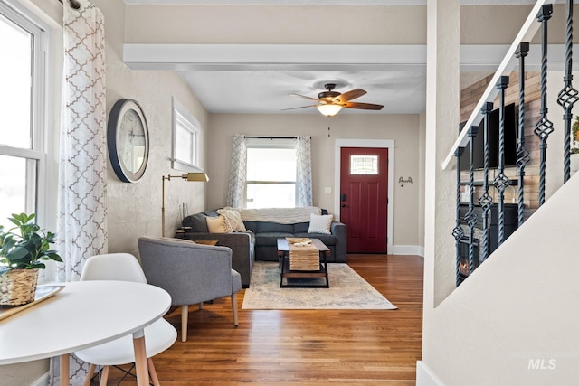 4705 W Franklin Rd, Boise, ID 83705 - living area with wood finished floors, a ceiling fan, and beam ceiling