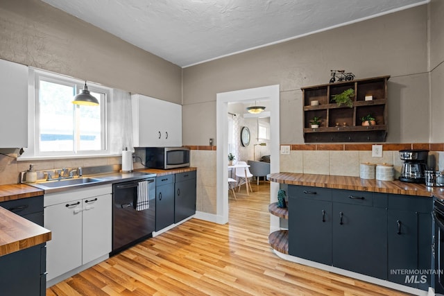 4705 W Franklin Rd, Boise, ID 83705 - kitchen featuring black dishwasher, butcher block counters, and open shelves