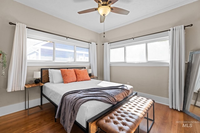 4705 W Franklin Rd, Boise, ID 83705 - bedroom with wood finished floors and ceiling fan