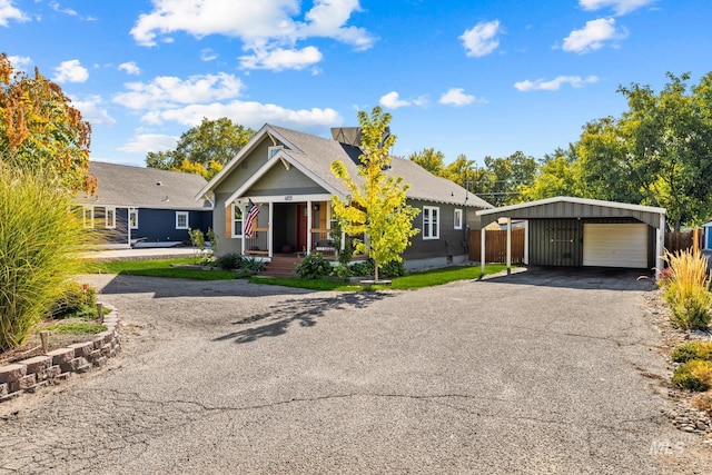 4705 W Franklin Rd, Boise, ID 83705 - view of front of home with a porch, a garage, and an outbuilding