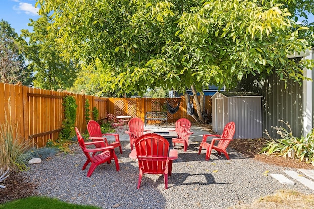 4705 W Franklin Rd, Boise, ID 83705 - fenced backyard with a fire pit and a storage unit