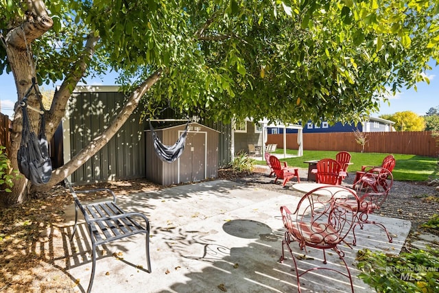 4705 W Franklin Rd, Boise, ID 83705 - fenced backyard featuring a storage shed and a patio area