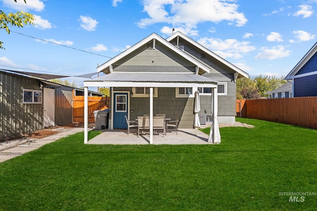 4705 W Franklin Rd, Boise, ID 83705 - rear view of property with a fenced backyard and a patio