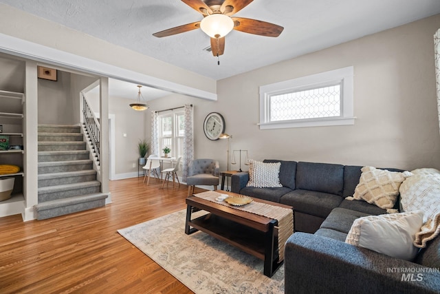 4705 W Franklin Rd, Boise, ID 83705 - living room with stairway, wood finished floors, and ceiling fan
