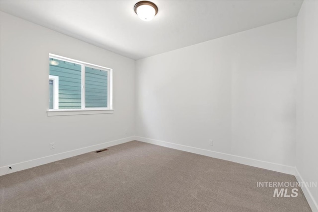 empty room featuring carpet floors