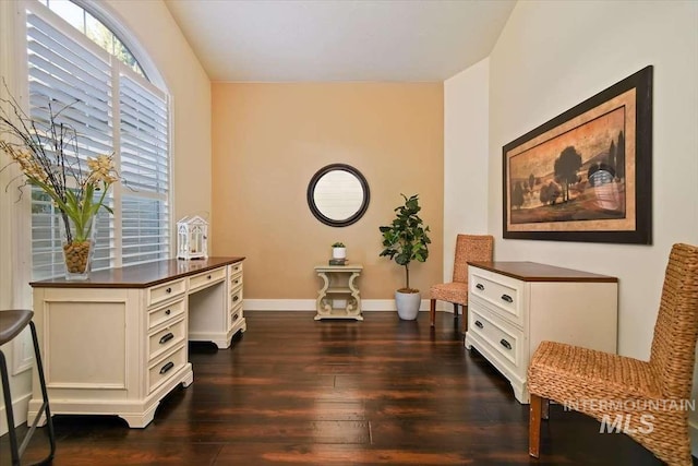 sitting room featuring dark wood finished floors and baseboards