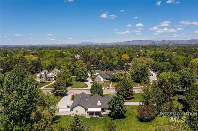 birds eye view of property with a forest view and a residential view