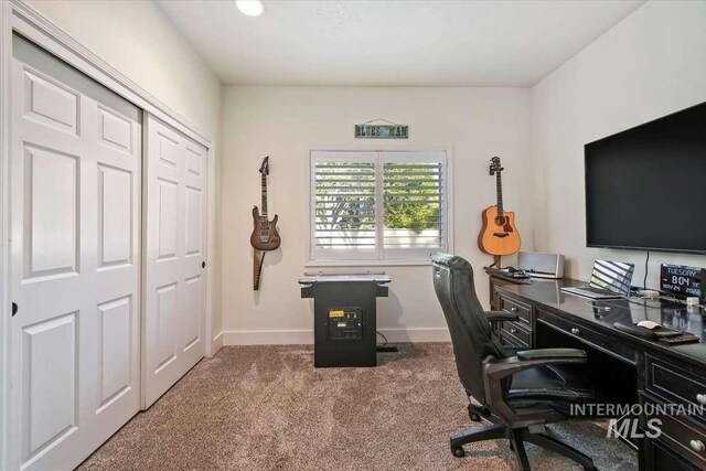 home office with carpet and baseboards