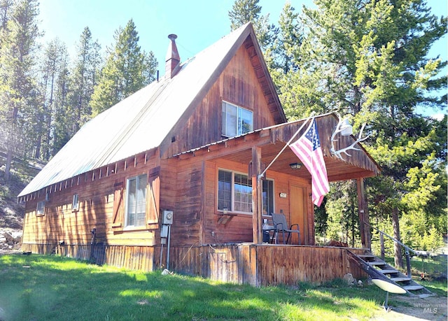 2738 Dixie Rd, Dixie, ID 83525 - view of front of house with covered porch, a chimney, and a front yard