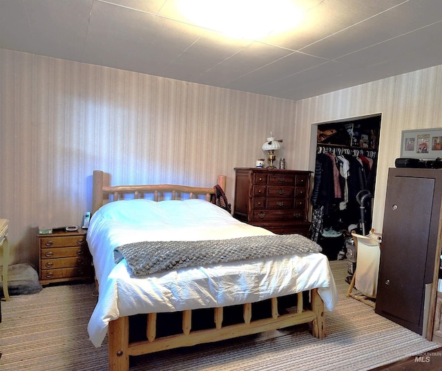 2738 Dixie Rd, Dixie, ID 83525 - carpeted bedroom with wallpapered walls and a closet