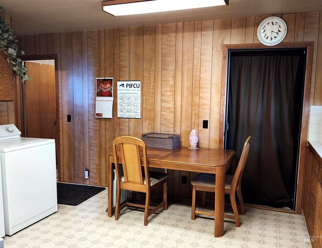2738 Dixie Rd, Dixie, ID 83525 - dining room with washer / clothes dryer, light floors, and wood walls