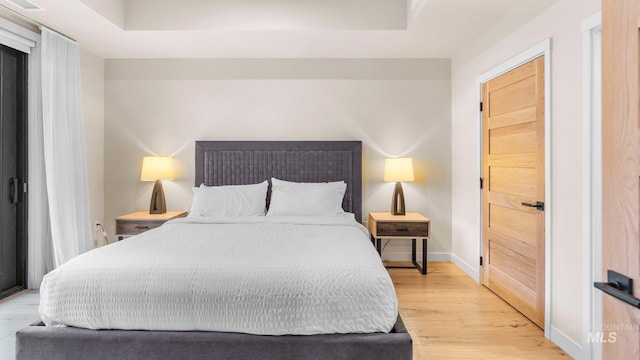 bedroom with light hardwood / wood-style floors