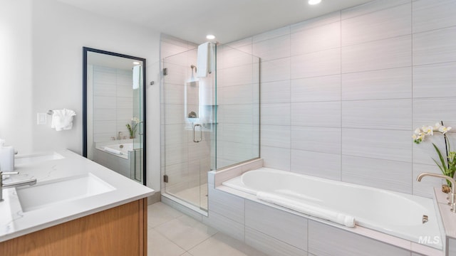 bathroom featuring vanity, separate shower and tub, and tile patterned flooring