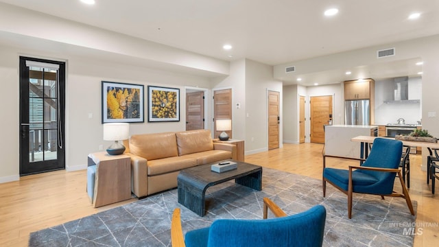 living room with light hardwood / wood-style floors