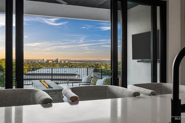 balcony at dusk with a fire pit