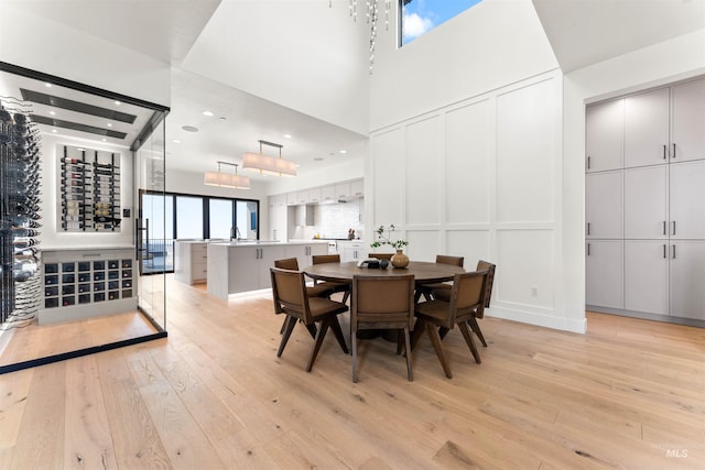 dining space with light hardwood / wood-style floors