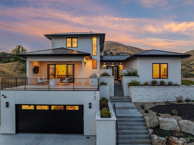 view of front of property featuring a mountain view and a garage