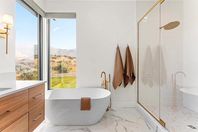 bathroom with plus walk in shower, a mountain view, and vanity