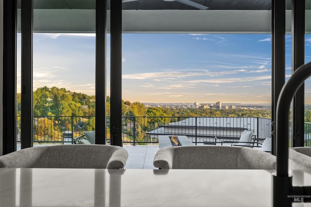 balcony at dusk with ceiling fan