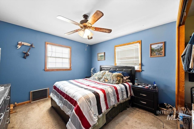 bedroom with ceiling fan and carpet flooring