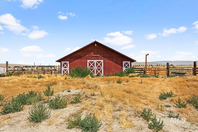 view of outdoor structure featuring a rural view