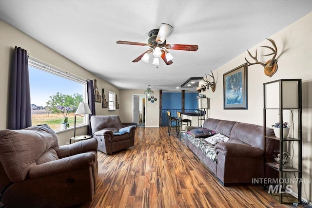 living room featuring hardwood / wood-style flooring and ceiling fan