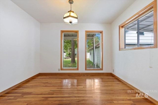 1915 N 23rd St, Boise, ID 83702 - empty room with wood finished floors and baseboards