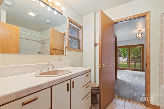1915 N 23rd St, Boise, ID 83702 - full bathroom with toilet, vanity, tile patterned floors, and a shower