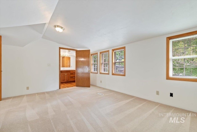 1915 N 23rd St, Boise, ID 83702 - unfurnished room featuring light carpet and lofted ceiling