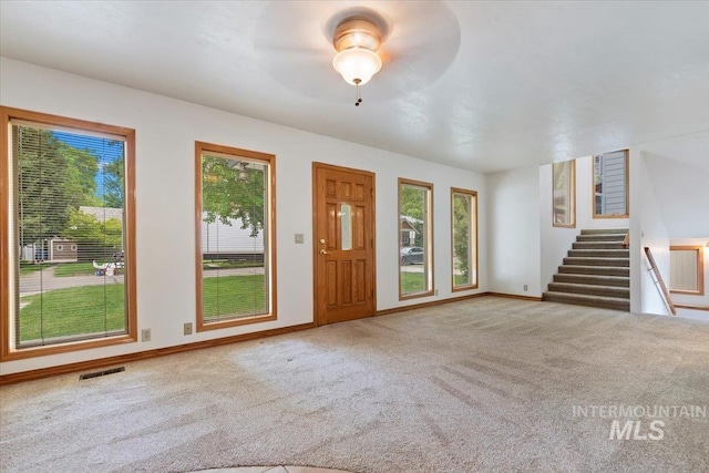 1915 N 23rd St, Boise, ID 83702 - carpeted entrance foyer with healthy amount of natural light, stairway, and baseboards