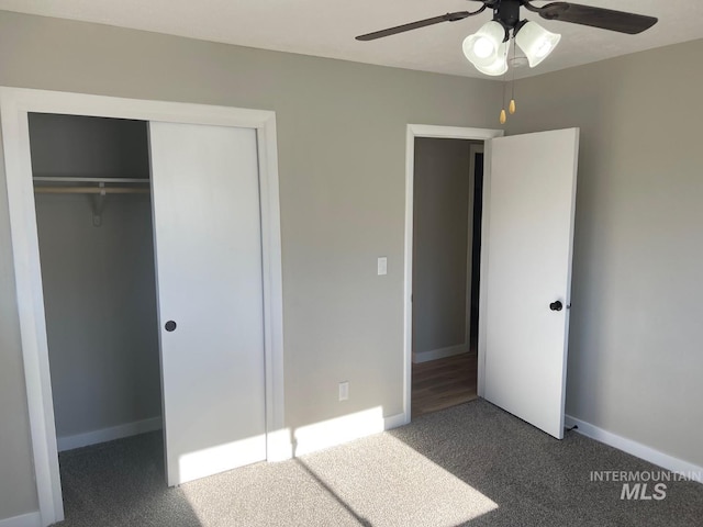 unfurnished bedroom with carpet flooring, ceiling fan, and a closet