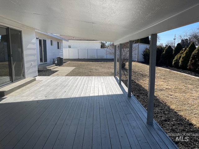 wooden terrace with central AC and a patio area