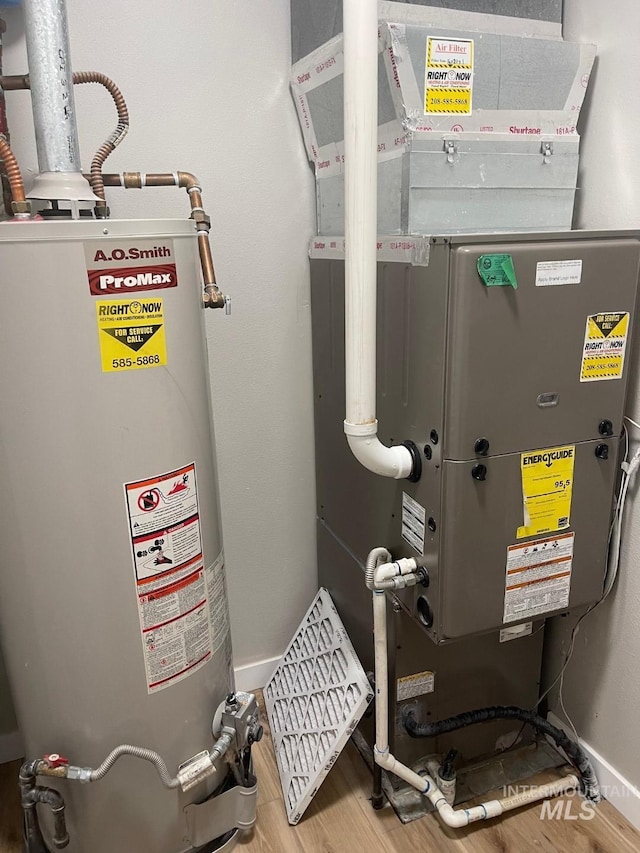 utility room with gas water heater and heating unit