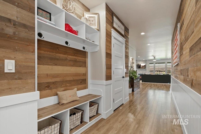 mudroom with ceiling fan and light hardwood / wood-style floors