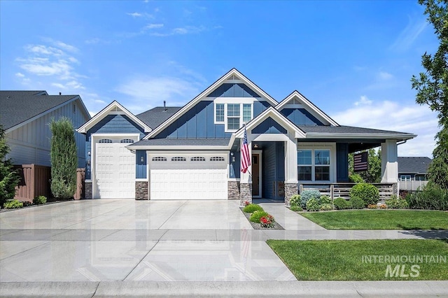 craftsman house featuring a porch and a front yard