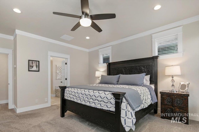 bedroom featuring carpet flooring, ceiling fan, and crown molding