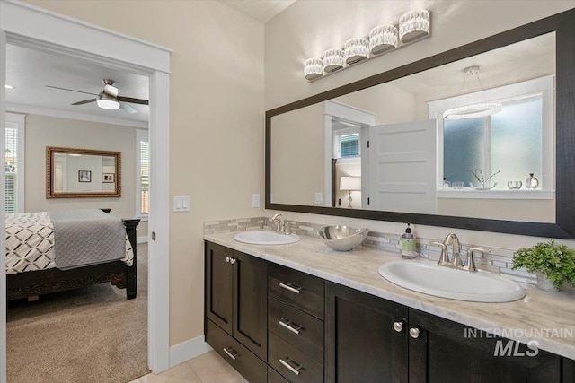 bathroom featuring tile patterned floors, ceiling fan, and vanity