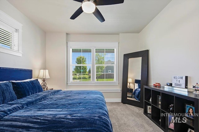 carpeted bedroom featuring ceiling fan