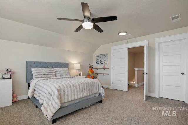 bedroom with ceiling fan, carpet floors, and vaulted ceiling