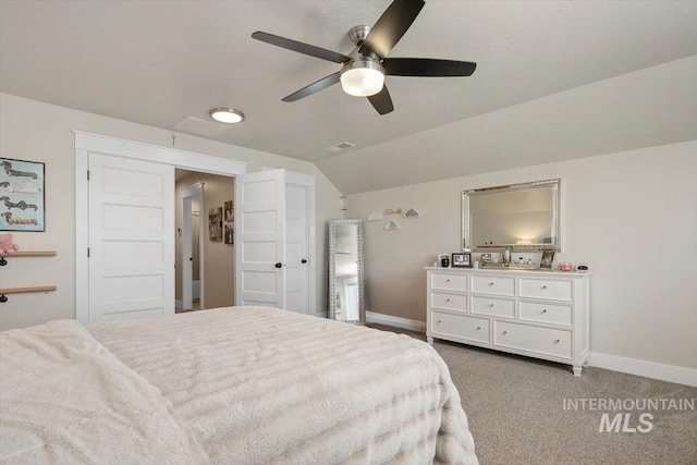 bedroom with carpet, ceiling fan, and lofted ceiling