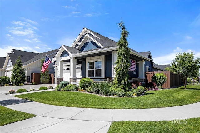 view of front of property with a front yard and covered porch