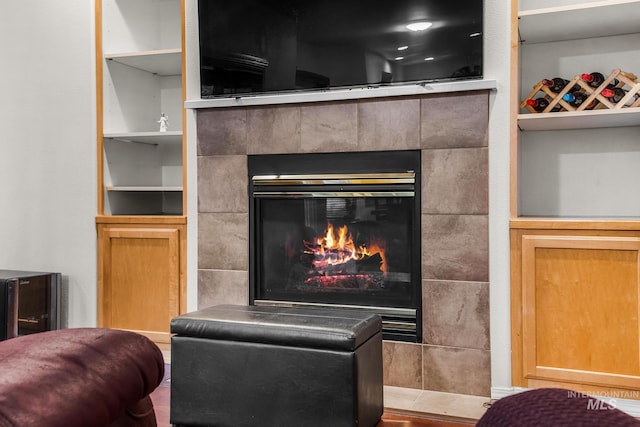 interior details with a tiled fireplace